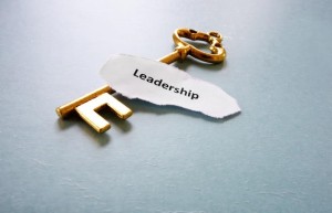 antique key with Leadership text on paper, macro